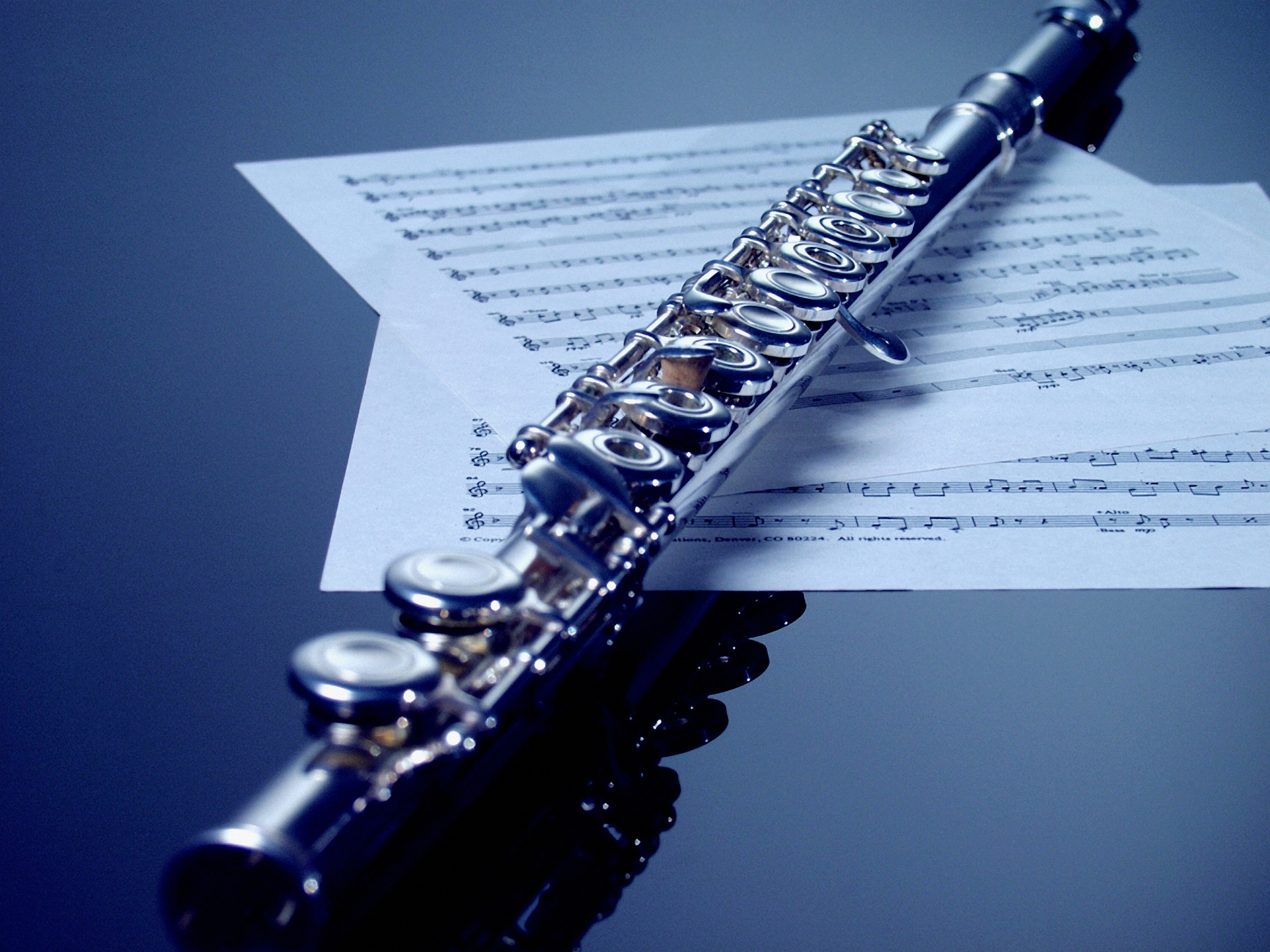 Flute on sheet music, close-up